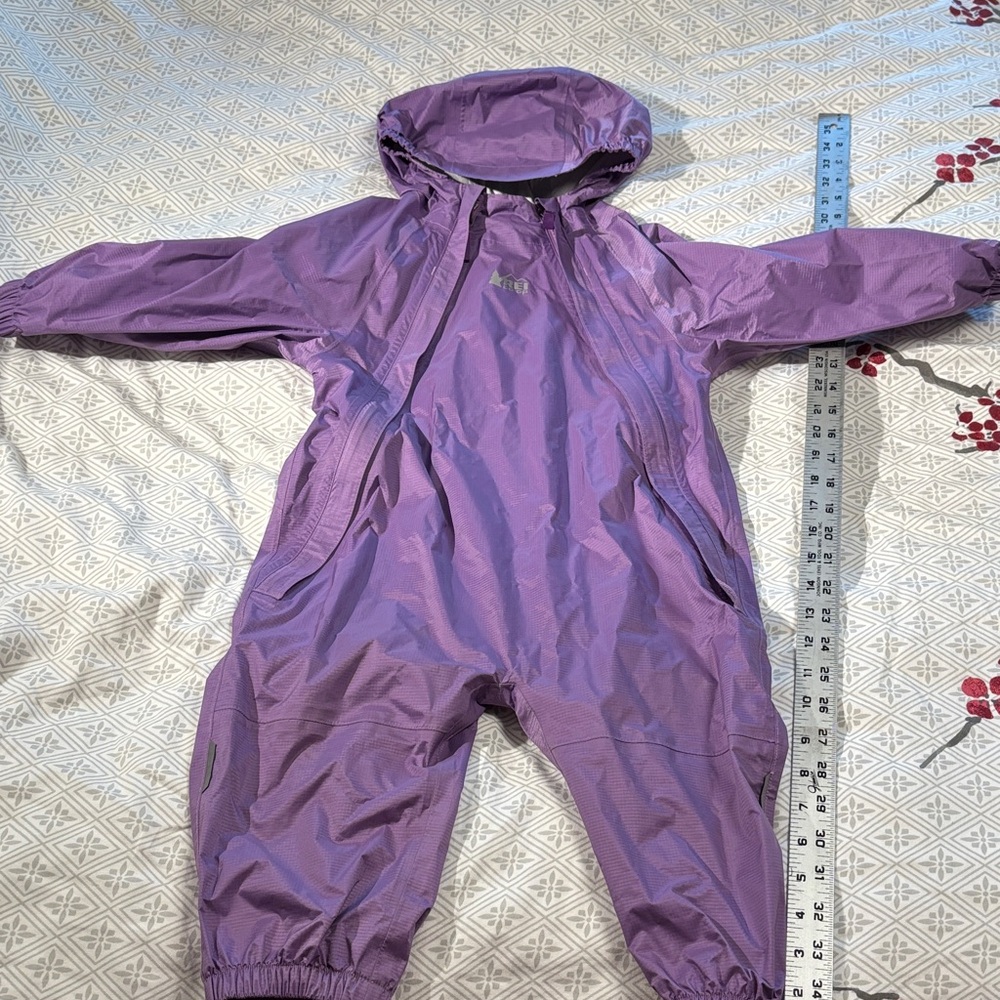 REI 2T rainsuit in purple gently used. One piece rainsuit muck suit.